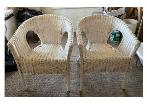 Two white wicker chairs